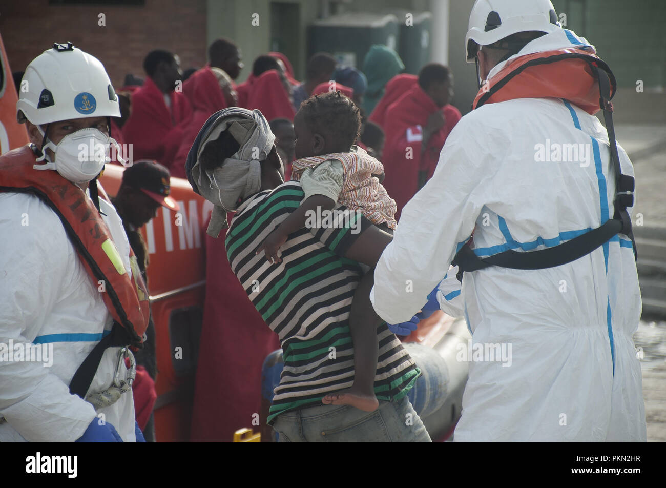 Malaga, MALAGA, Spain. 14th Sep, 2018. A migrant woman seen carrying her kid after getting off