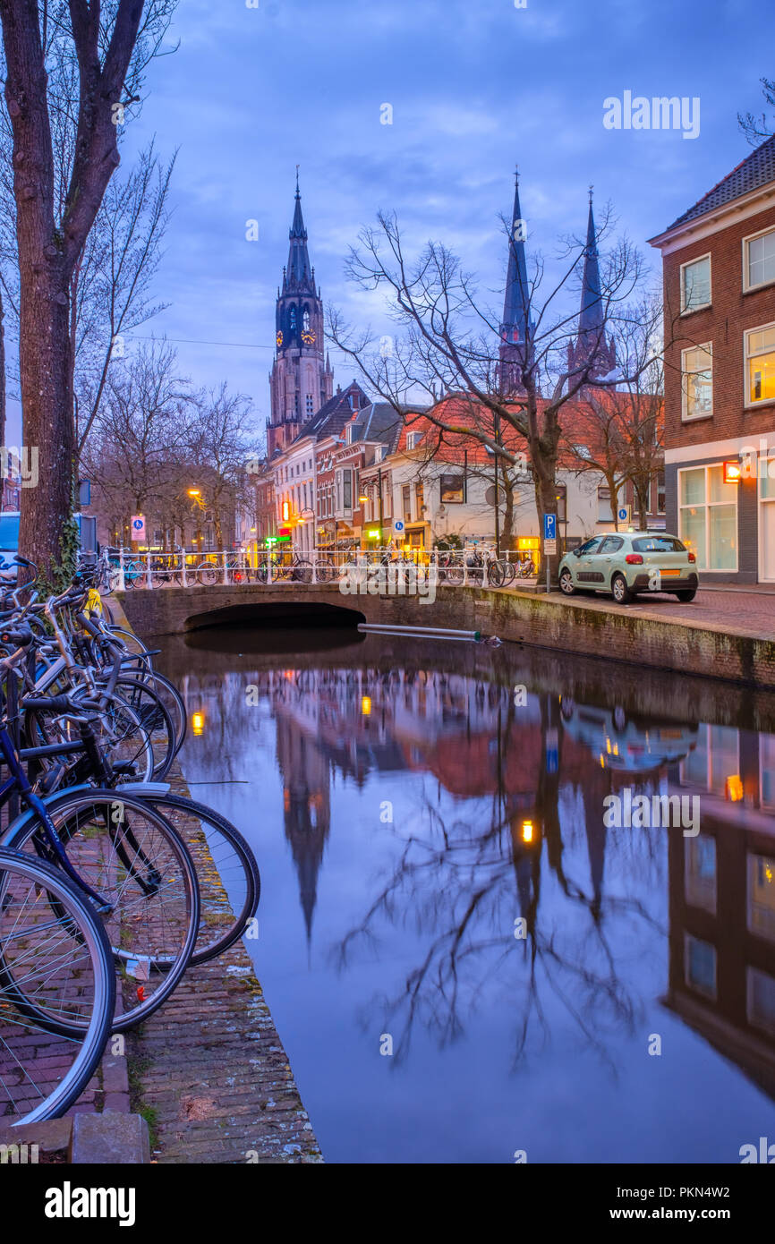 Evening view of the canal and the church in Delft. Dutch city in the ...