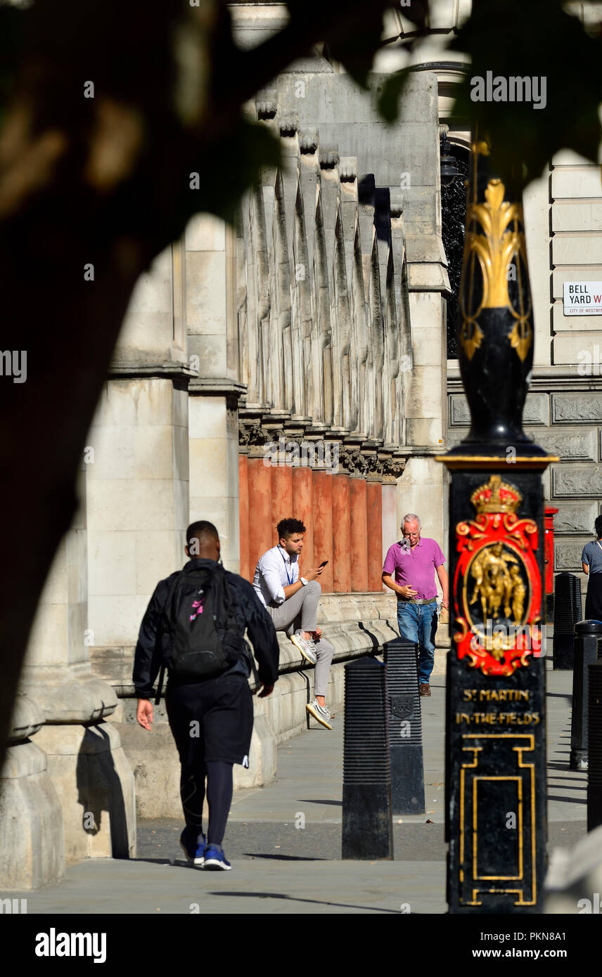 Fleet street, London, England, UK. Man on his mobile phoneby the Royal Courts of Justice Stock Photo