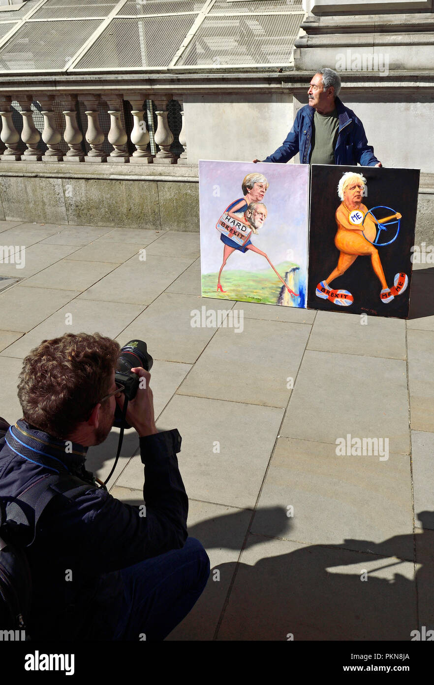 London, England, UK. Kaya Mar (artist) being photographed with two Brexit cartoons outside Downing Street during a 3 hour cabinet meeting to discuss B Stock Photo