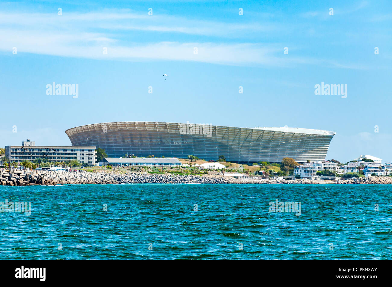 A paraglider above the Cape Town football stadium by the sea, South Africa Stock Photo