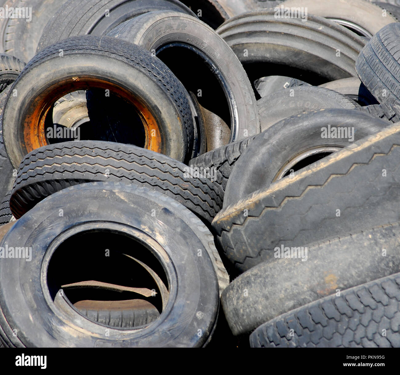 Pile of tires in a junk yard Stock Photo Alamy