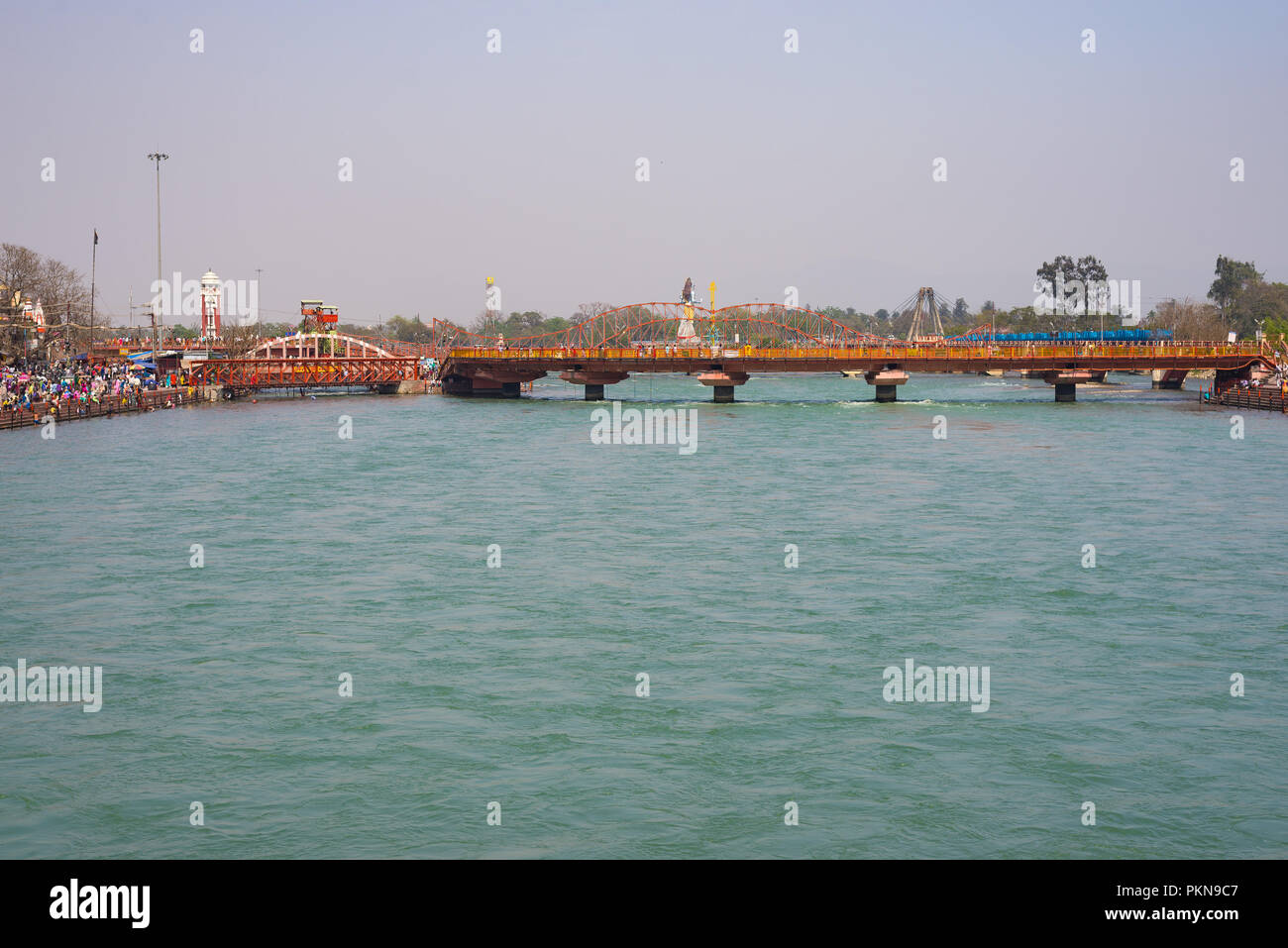 Haridwar, India - March 20, 2017: Holy ghats and temples at Haridwar, India, sacred town for Hindu religion. Pilgrims praying and bathing in the Gange Stock Photo