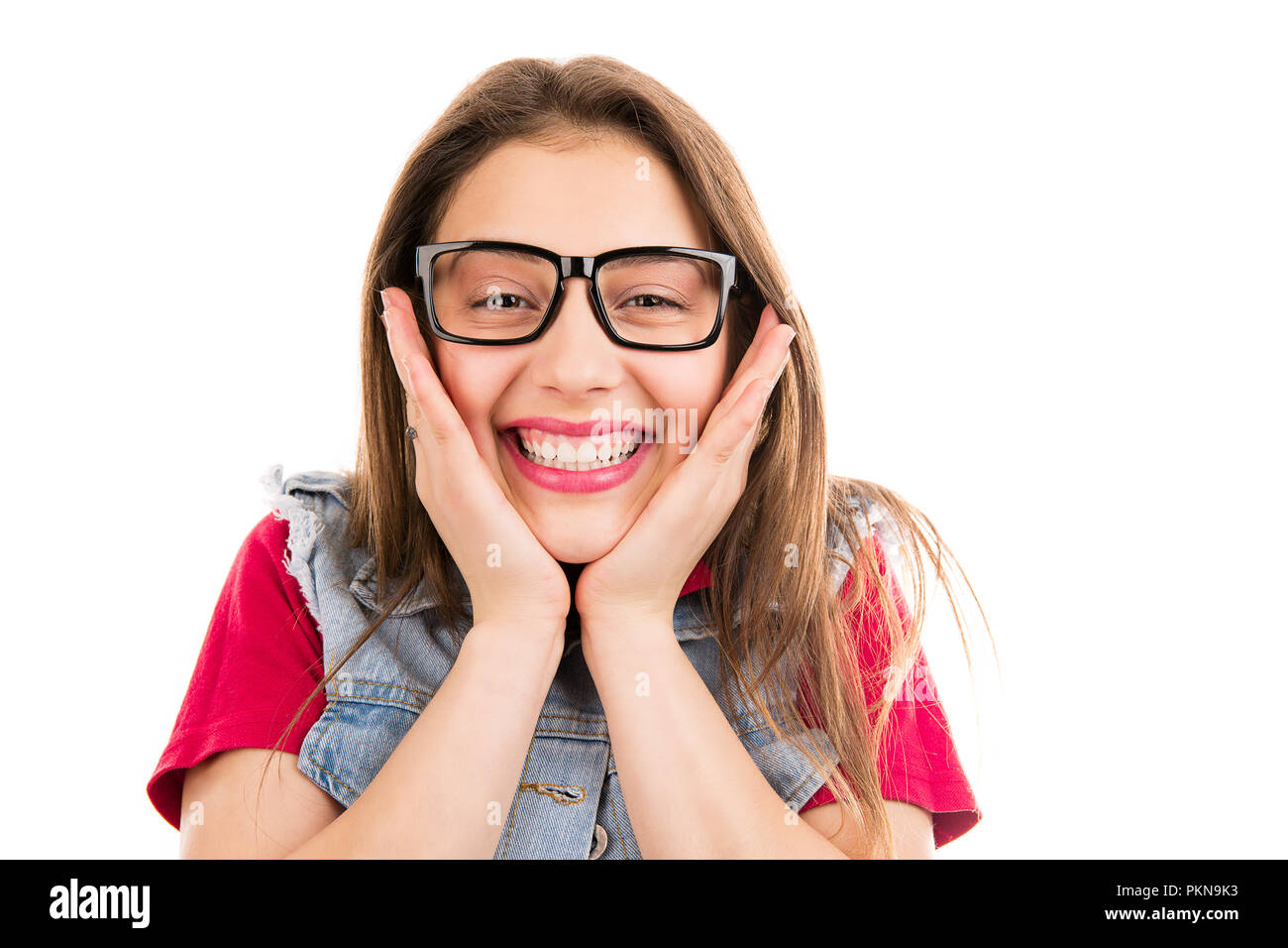 Happy young cool woman in glasses touching cheeks in excitement looking at camera isolated on white background Stock Photo