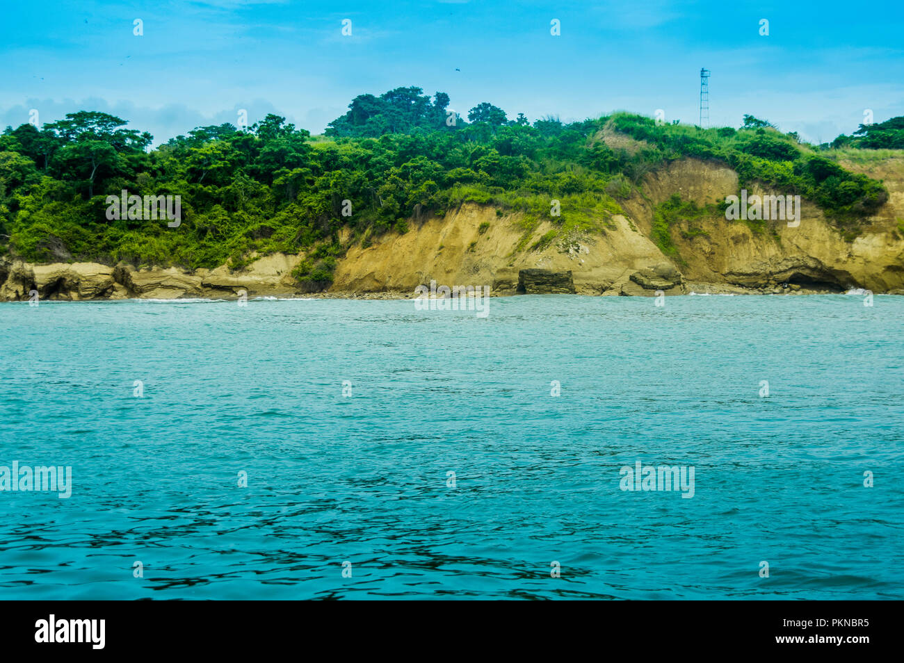 Beautiful outdoor view of island with vegetation and blue