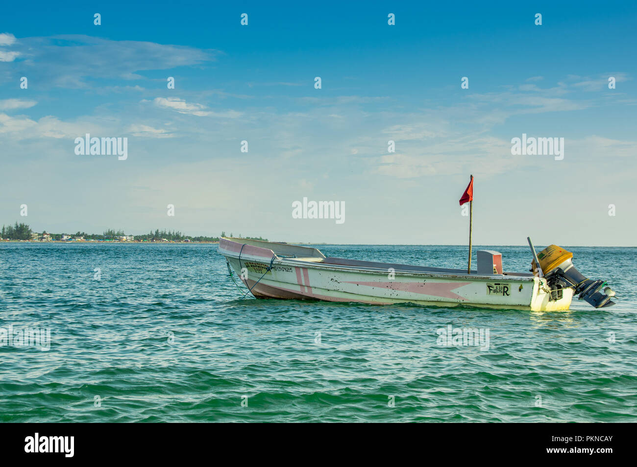 MANABI, ECUADOR, MAY, 29, 2018 Outdoor view of fishing boat in the ocean during a gorgeous sunny day in the beach of Cojimies Stock Photo