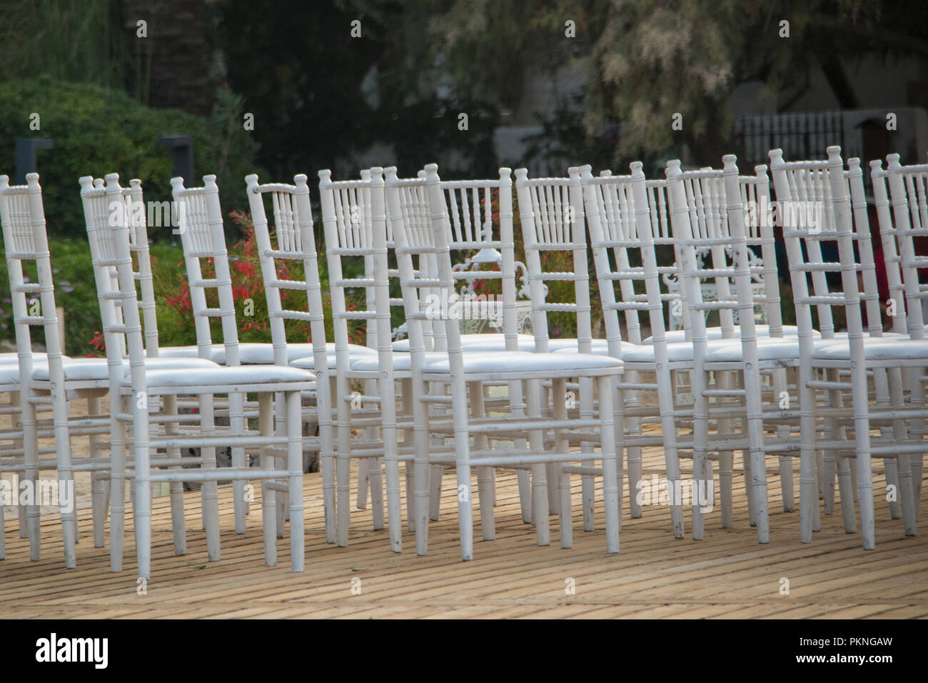seaside wedding flowers, white chairs white candlesticks Stock Photo