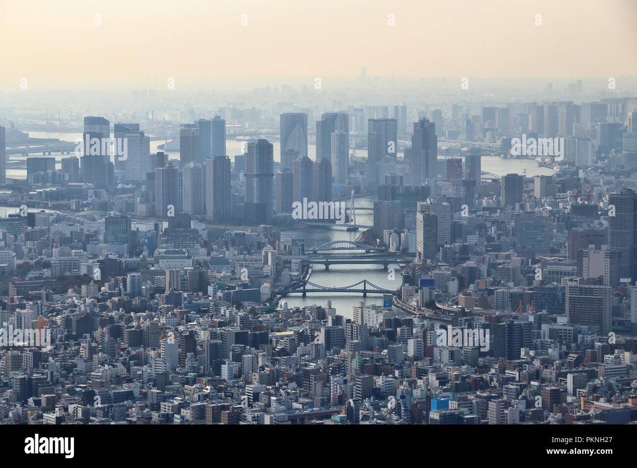 Tokyo city, Japan. Hazy skyline of Chuo ward and Tsukishima island. Stock Photo