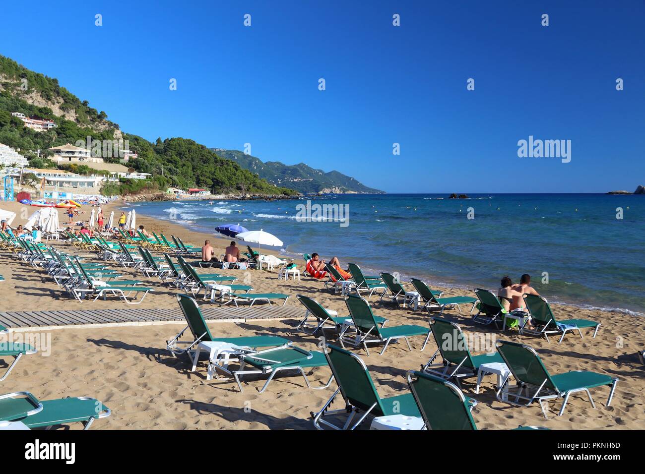 CORFU, GREECE JUNE 3, 2016 People enjoy the beach in Pelekas, Corfu
