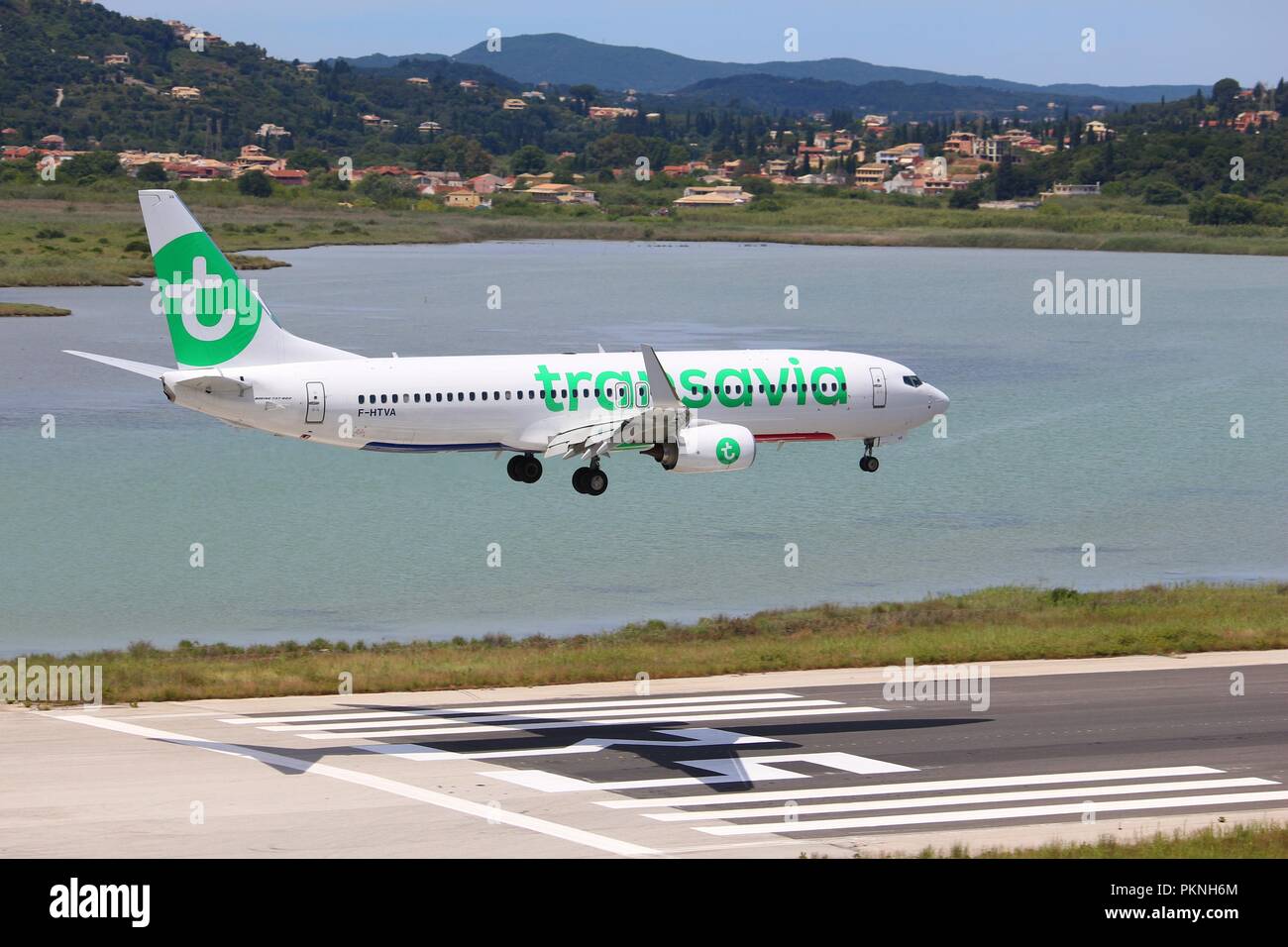 CORFU, GREECE - JUNE 5, 2016: Transavia Boeing 737-800 arrives at Corfu International Airport, Greece. Transavia is a Dutch low-cost airline owned by  Stock Photo
