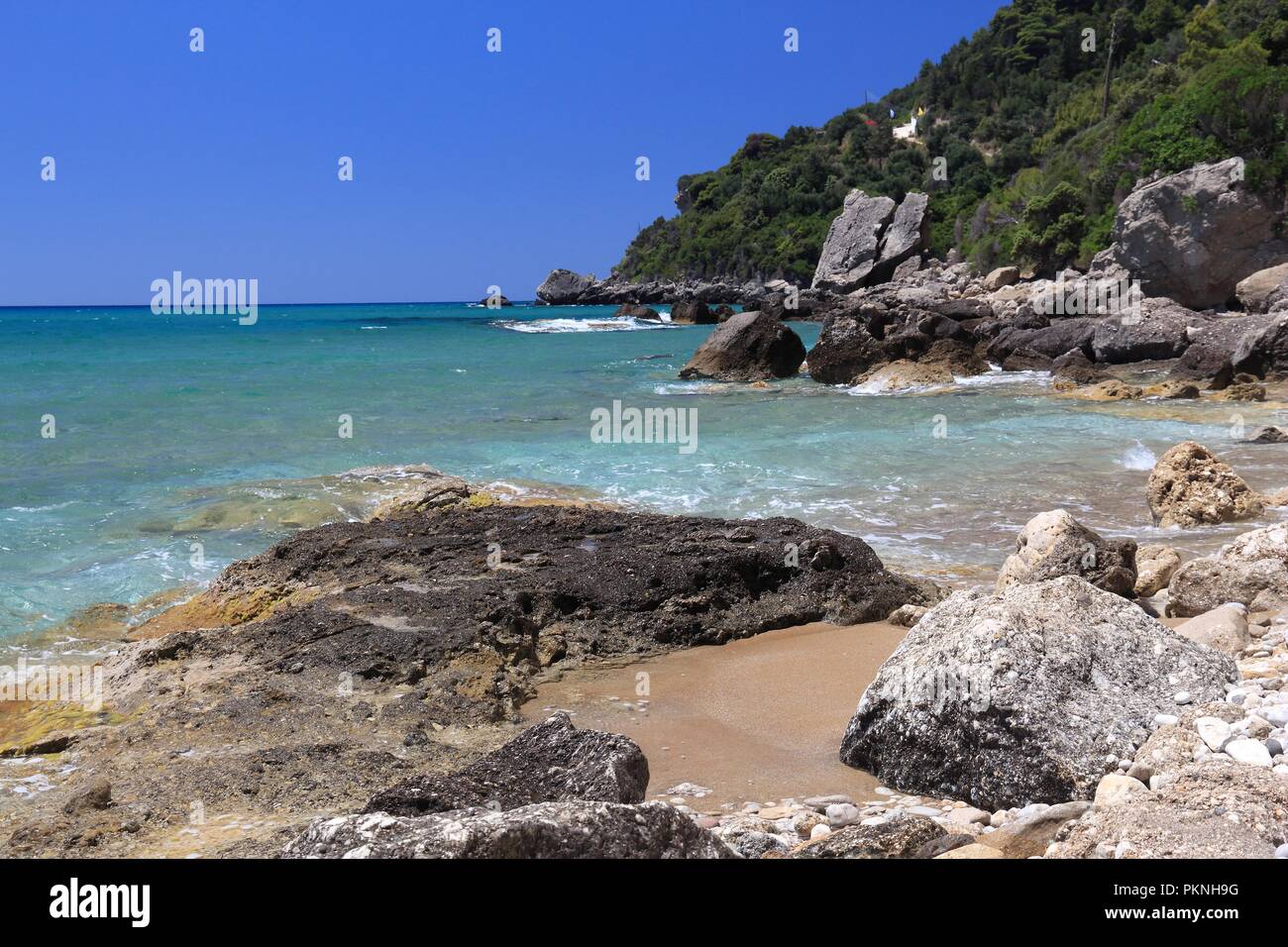 Corfu beach landscape - island in Greece. Myrtiotissa Beach below the cliffs. Stock Photo