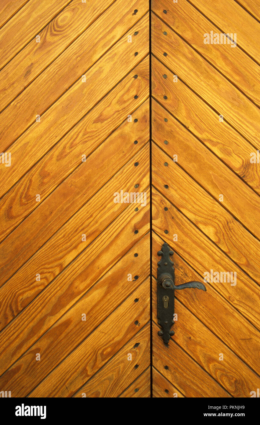 Wooden front door and metal handle in Pollena Old Town on the Island of Mallorca Stock Photo