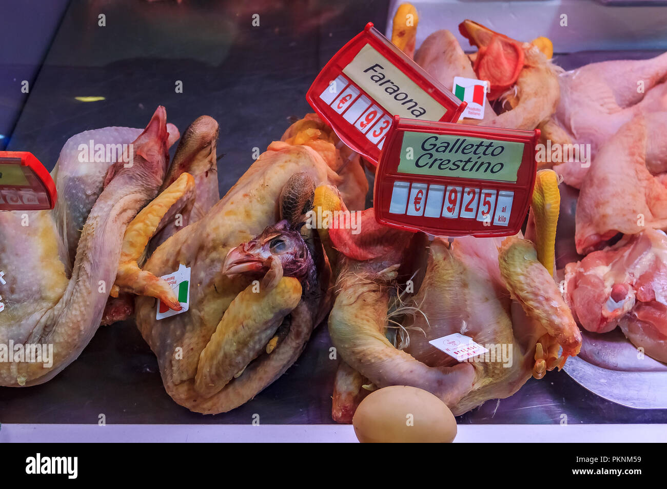 Plucked chickens for sale at the market in Ventimiglia, Liguria region of Italy Stock Photo