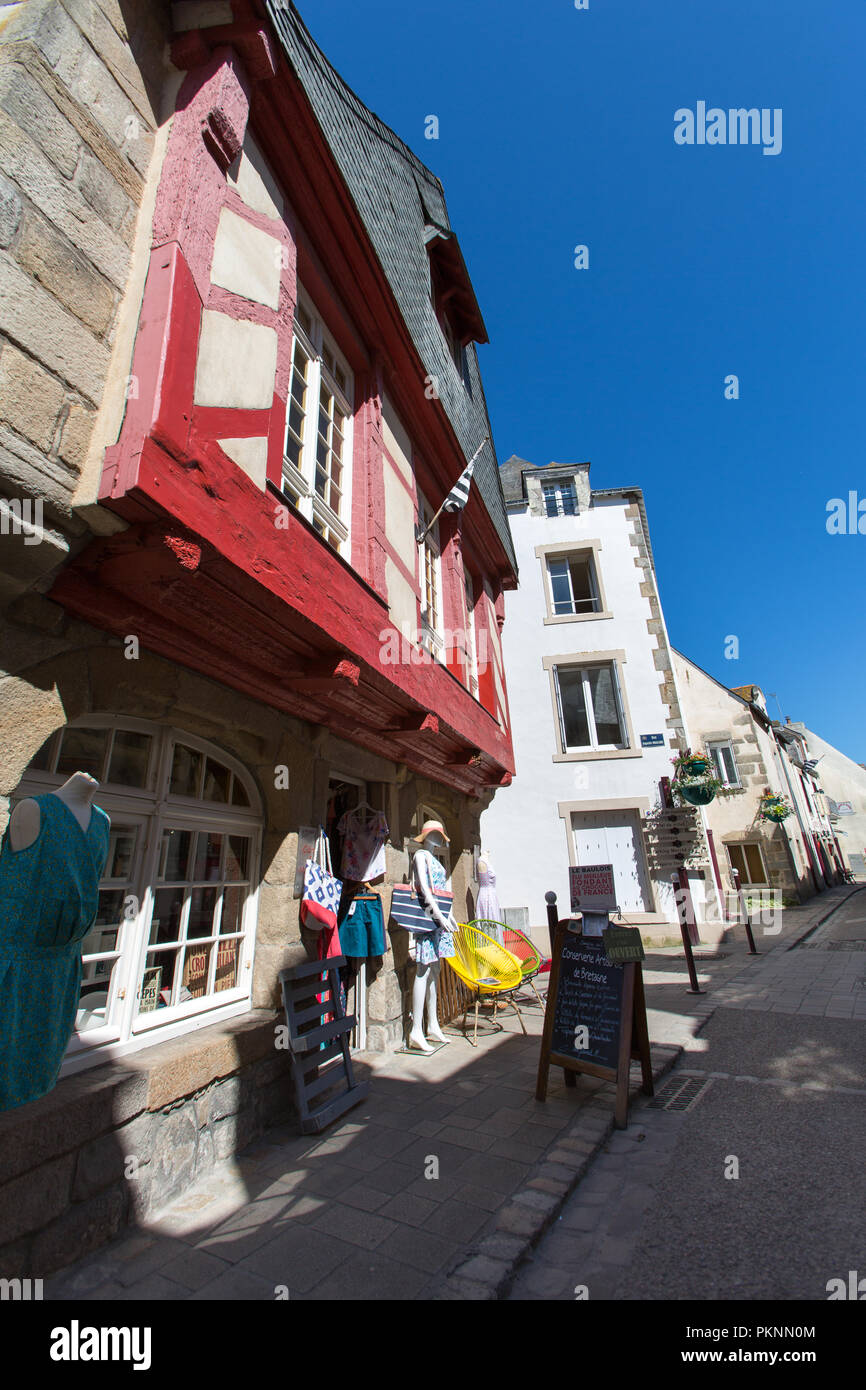 Le Croisic, France. Picturesque view of residential dwellings and a clothing (vetements) shop at Le Croisic’s Rue de l'Église. Stock Photo