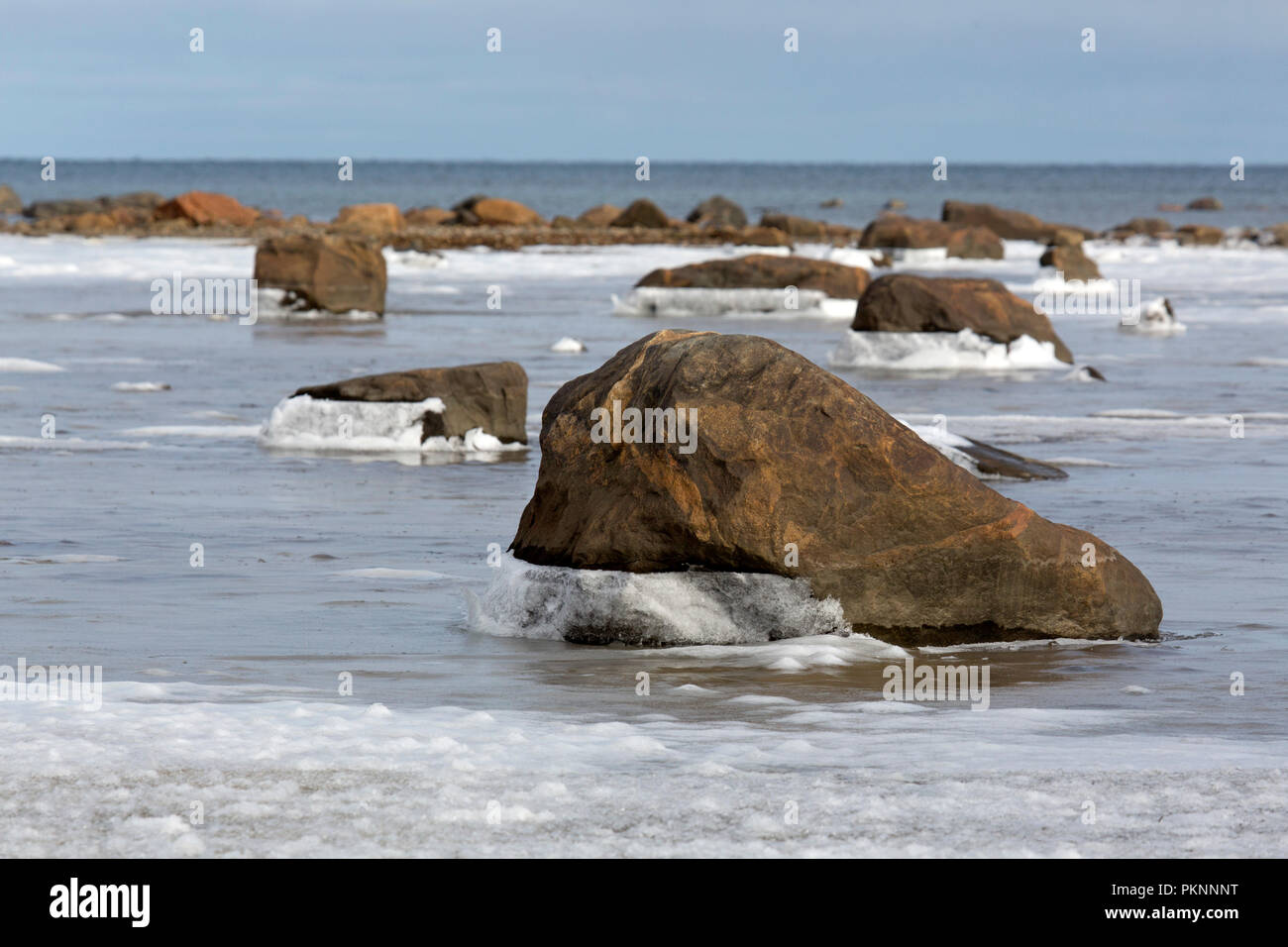 Icy rocks by the Seal River in Manitoba, Canada. The river opens into the Hudson Bay. Stock Photo