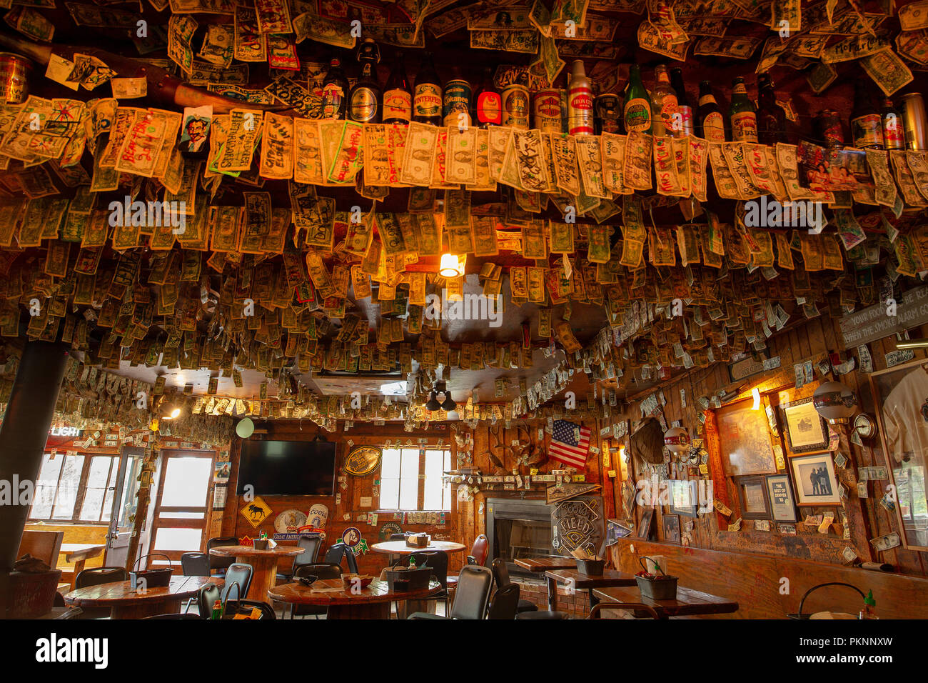 Bucksnort saloon near Pine Grove Colorado.A A mountain bar with dollar bills signed by visitors on the walls and ceiling. Stock Photo