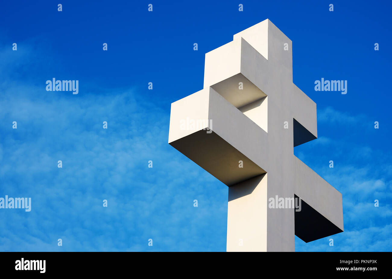 Big white cross at Velehrad Basilica, with blue sky and clouds in the background, with space fot text Stock Photo