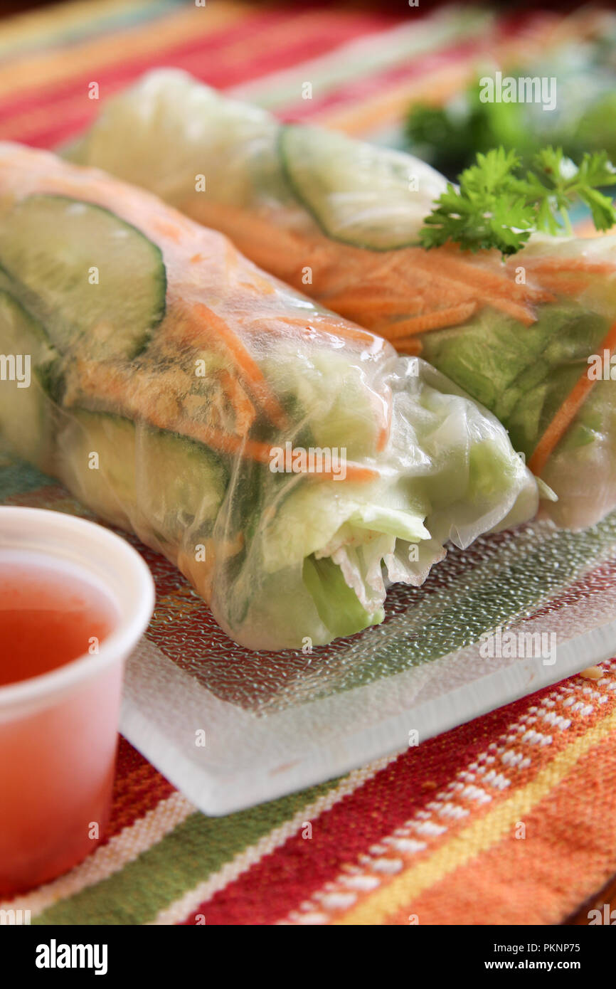 Fresh Vietnamese rolls wrapped in rice paper filled with vegetables and ...