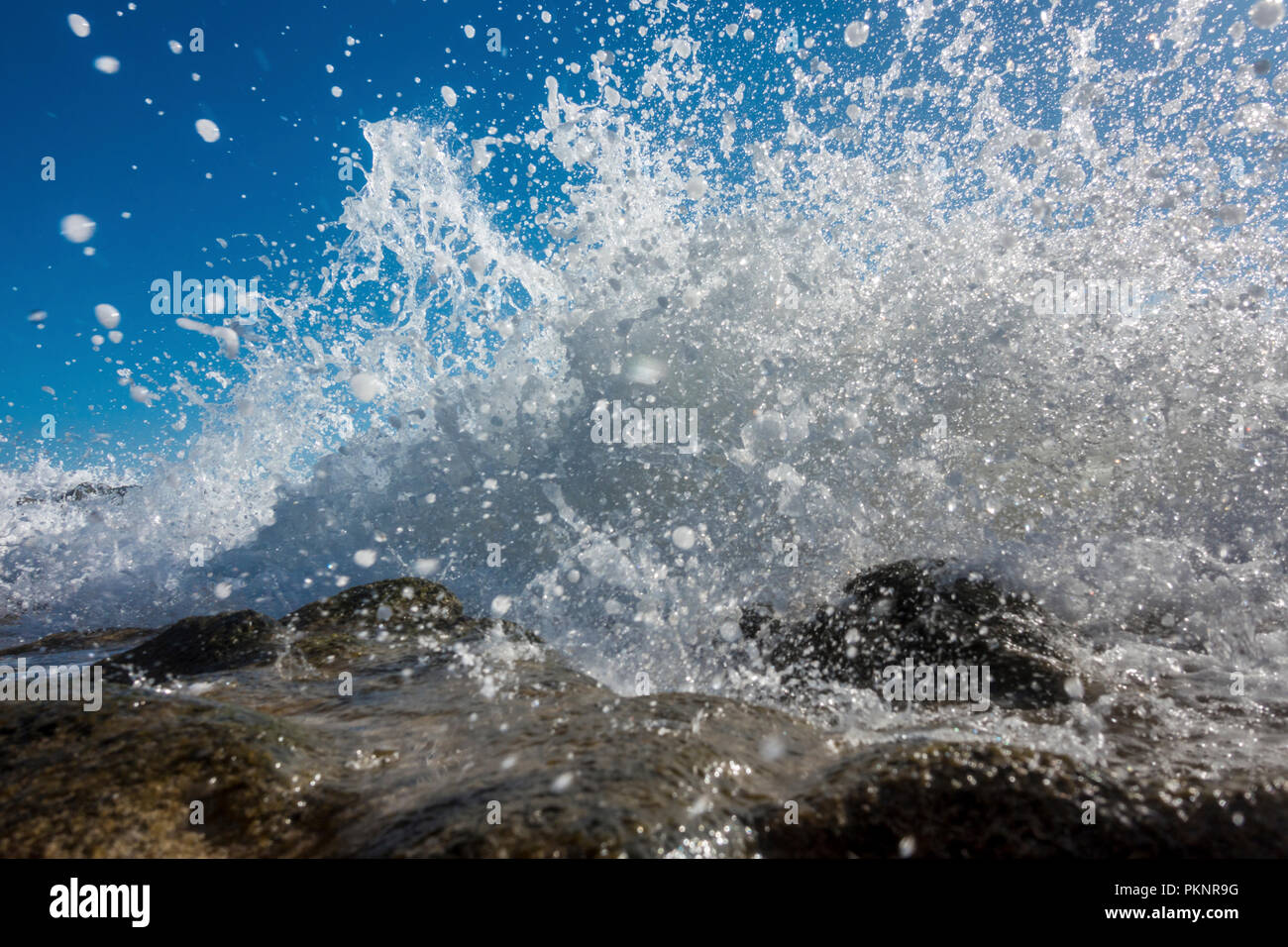 Blue ocean water splashed against hi-res stock photography and images ...