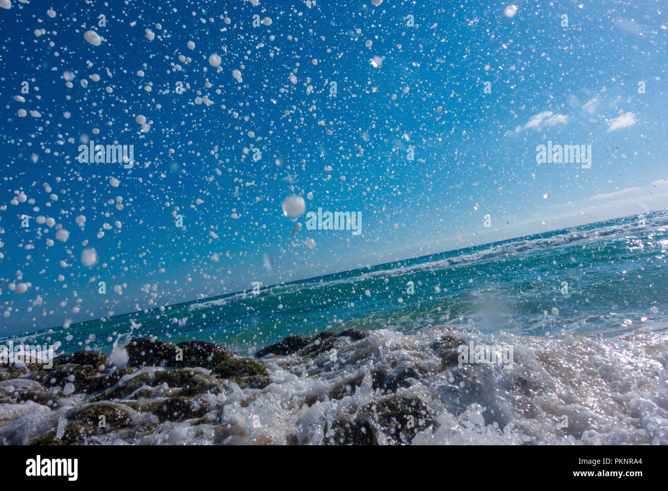 Blue ocean water splashed against hi-res stock photography and images ...