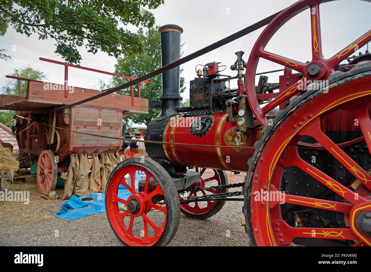 A threshing machine being powered by a traction engine at the 2018 Low