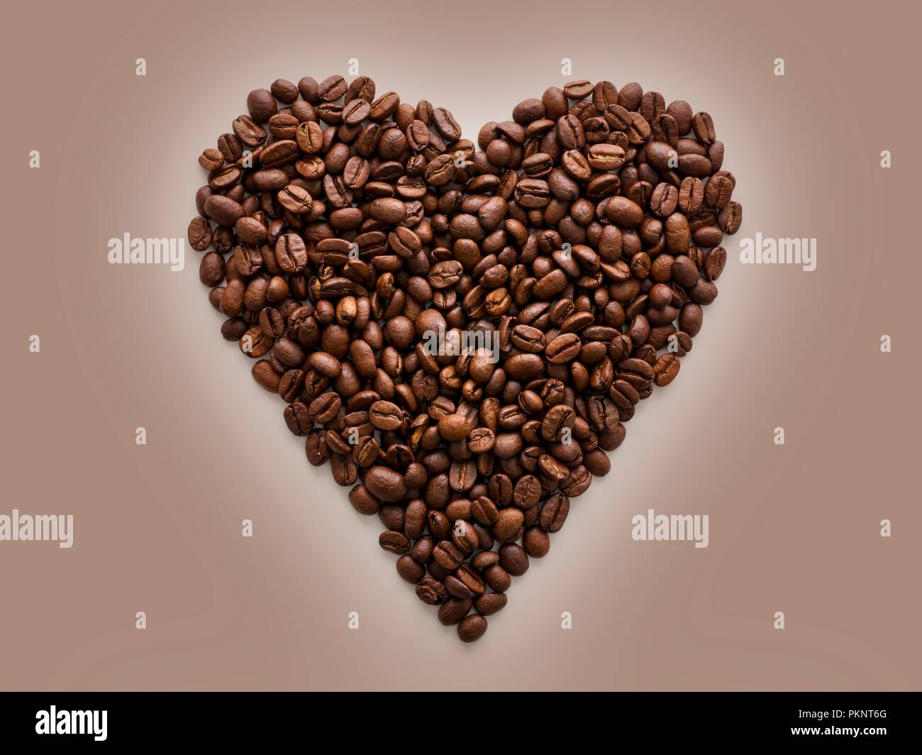 Coffee beans in a heart shape. Stock Photo
