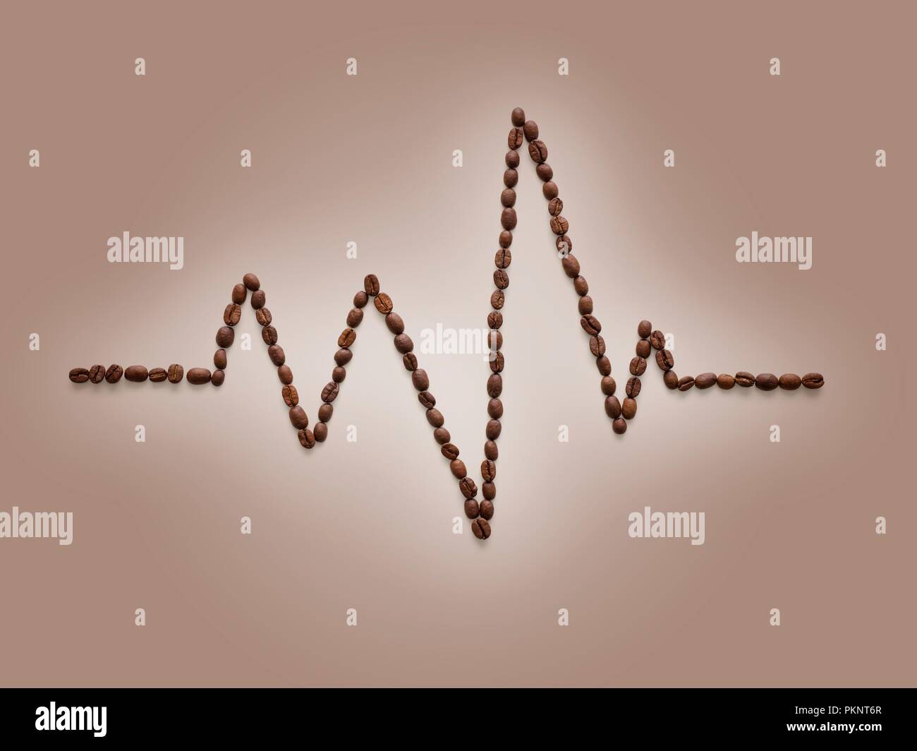 Coffee beans making an electrocardiogram line. Stock Photo
