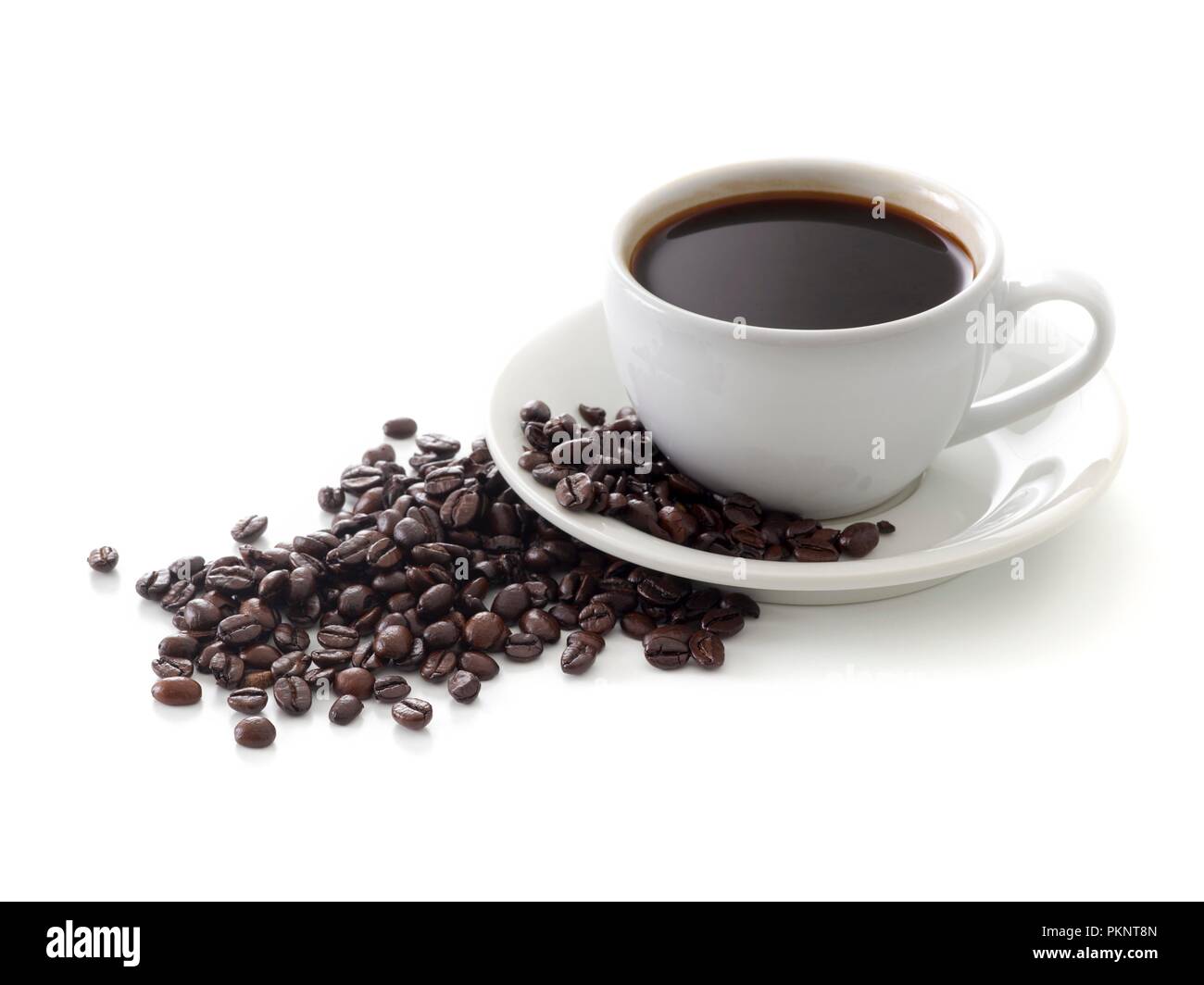 Black coffee in cup with beans. Stock Photo