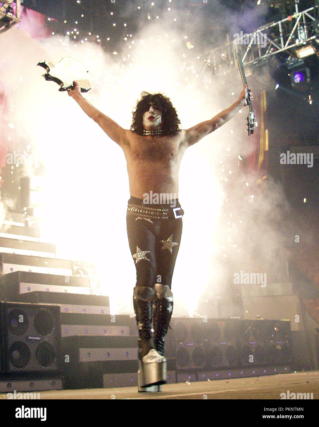 Paul Stanley of KISS breaks his guitar during a performance