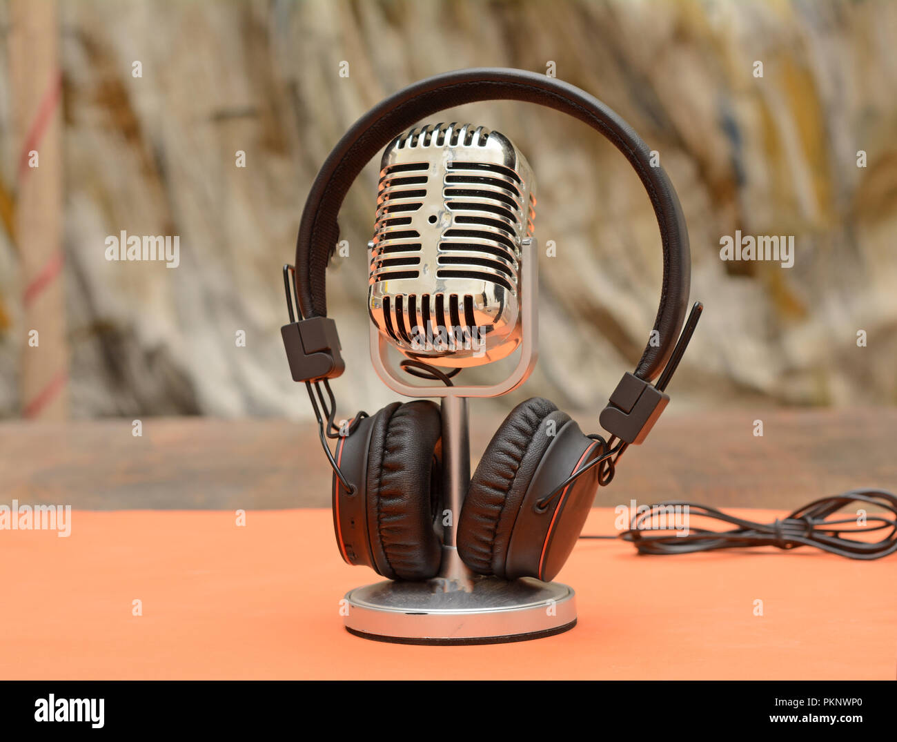 Wireless headphone with microphone on table, Music theme Stock Photo