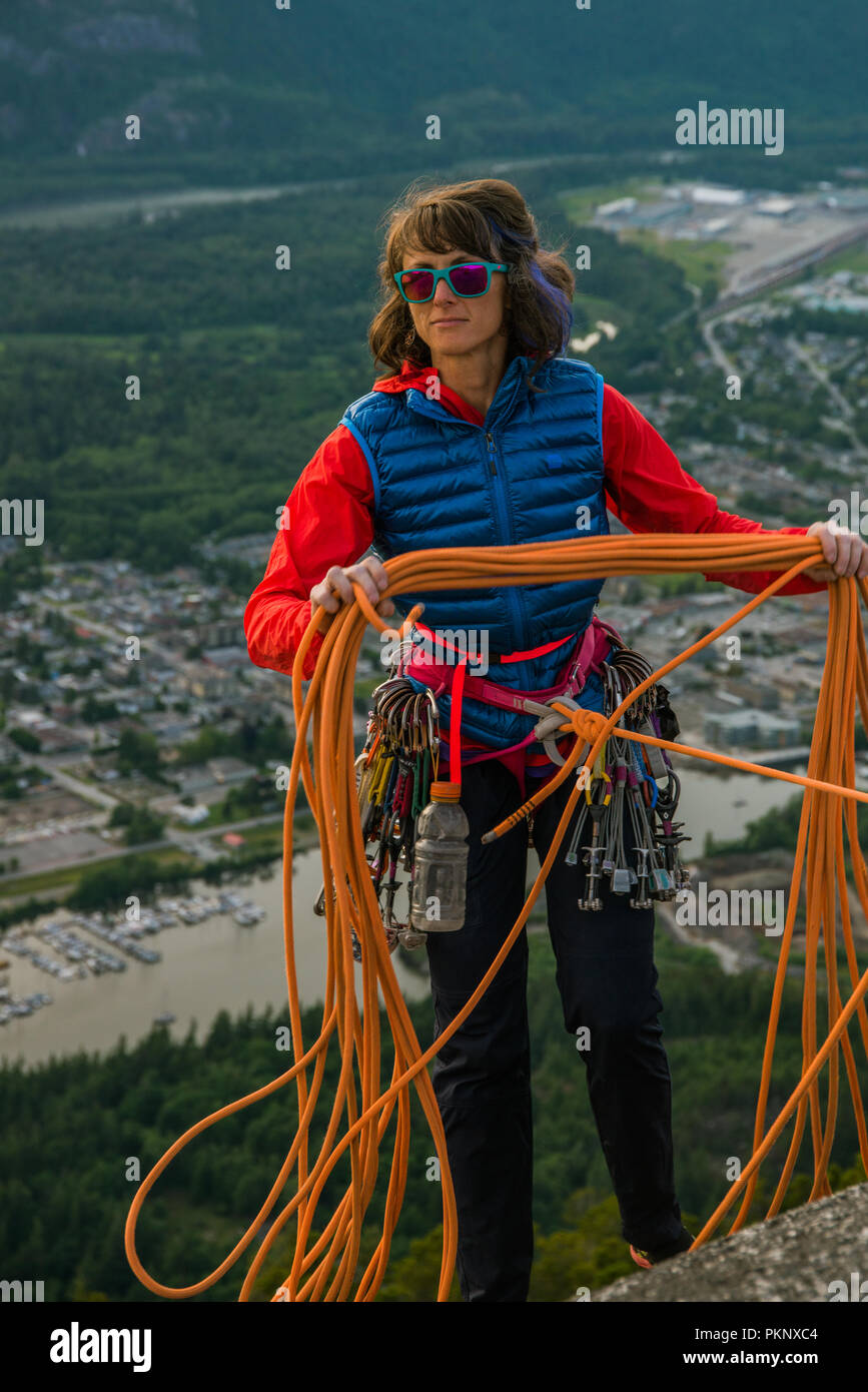 Rock climber at the top of the Stawmus Chief ion Squamish, British Columbia Canada. Stock Photo