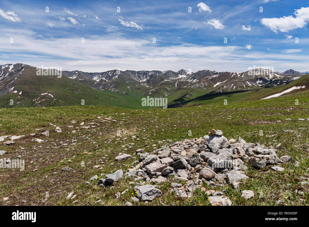 Foothills of Terskey Ala-Too mountain range as seen from Anvar Pass, Keskenkyia Loop trek, Jyrgalan, Kyrgyzstan Stock Photo