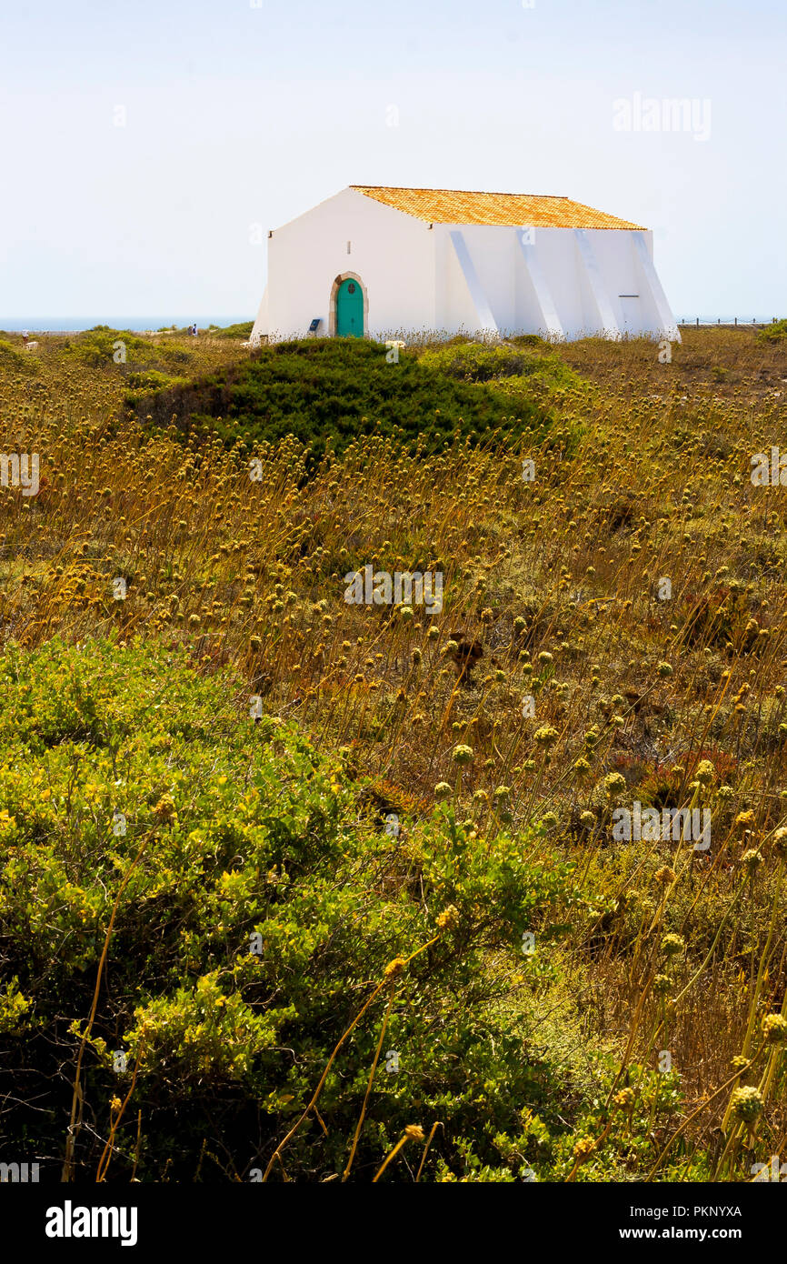 A little white house in the countryside Stock Photo