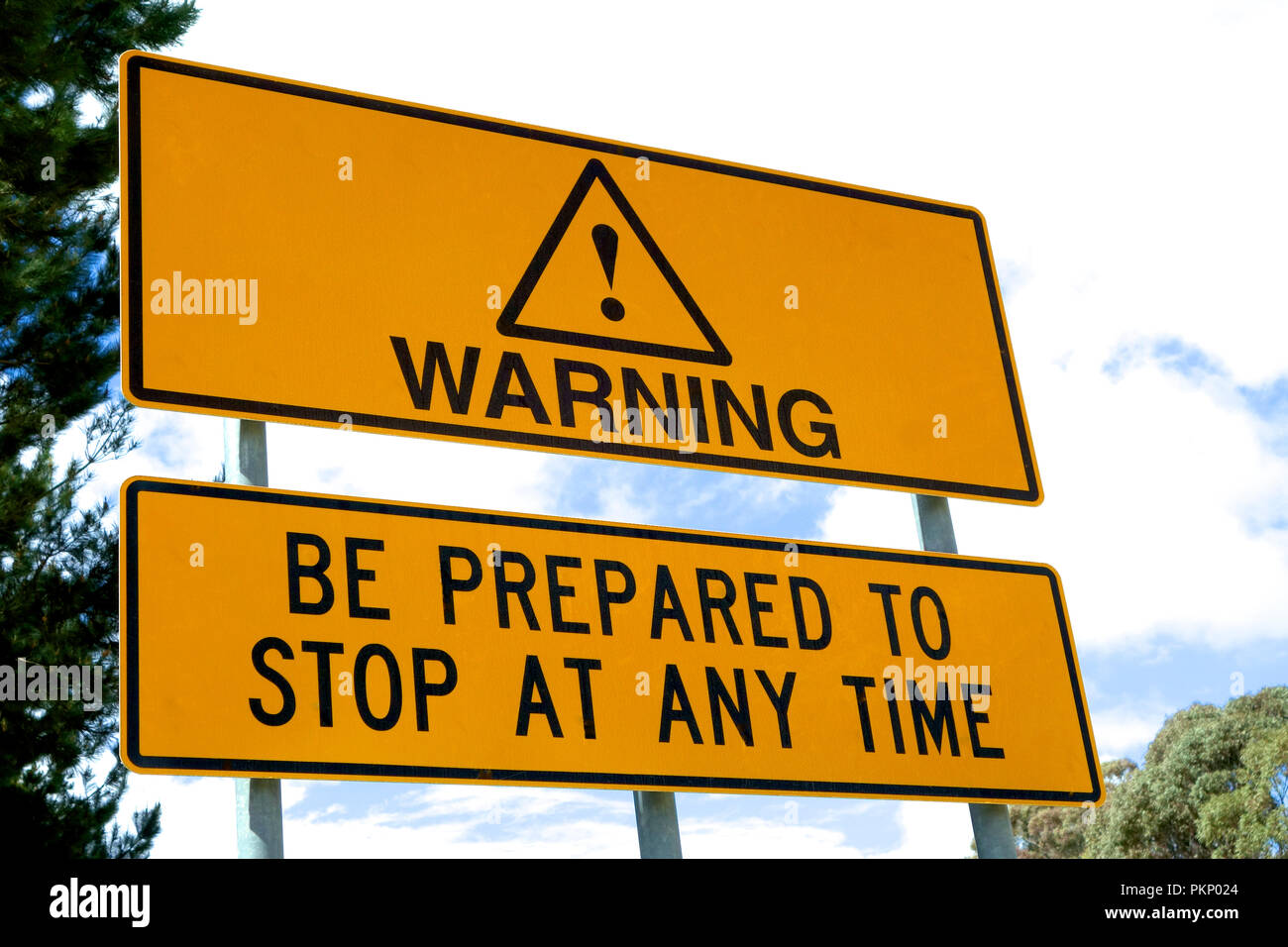 Warning: Be Prepared to Stop at Anytime signage. Stock Photo