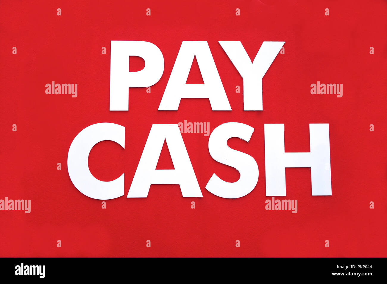 Pay cash signage outside a retail shop. Stock Photo
