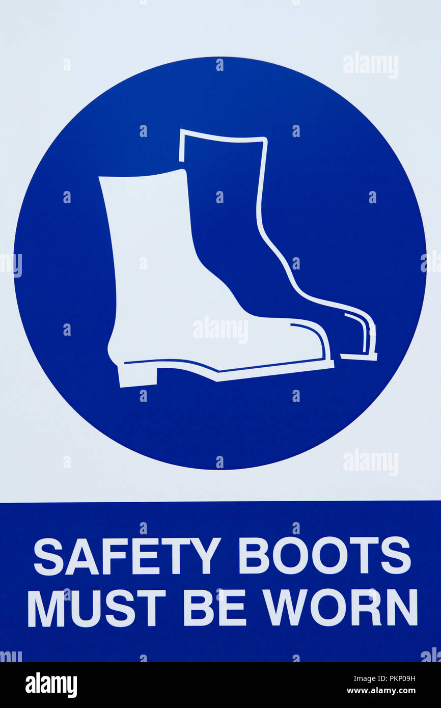Safety Boots Must be Worn sign. Stock Photo