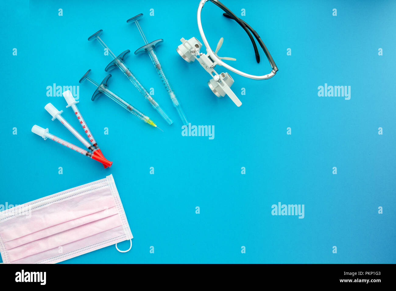Medical equipments including surgical instruments on a blue background