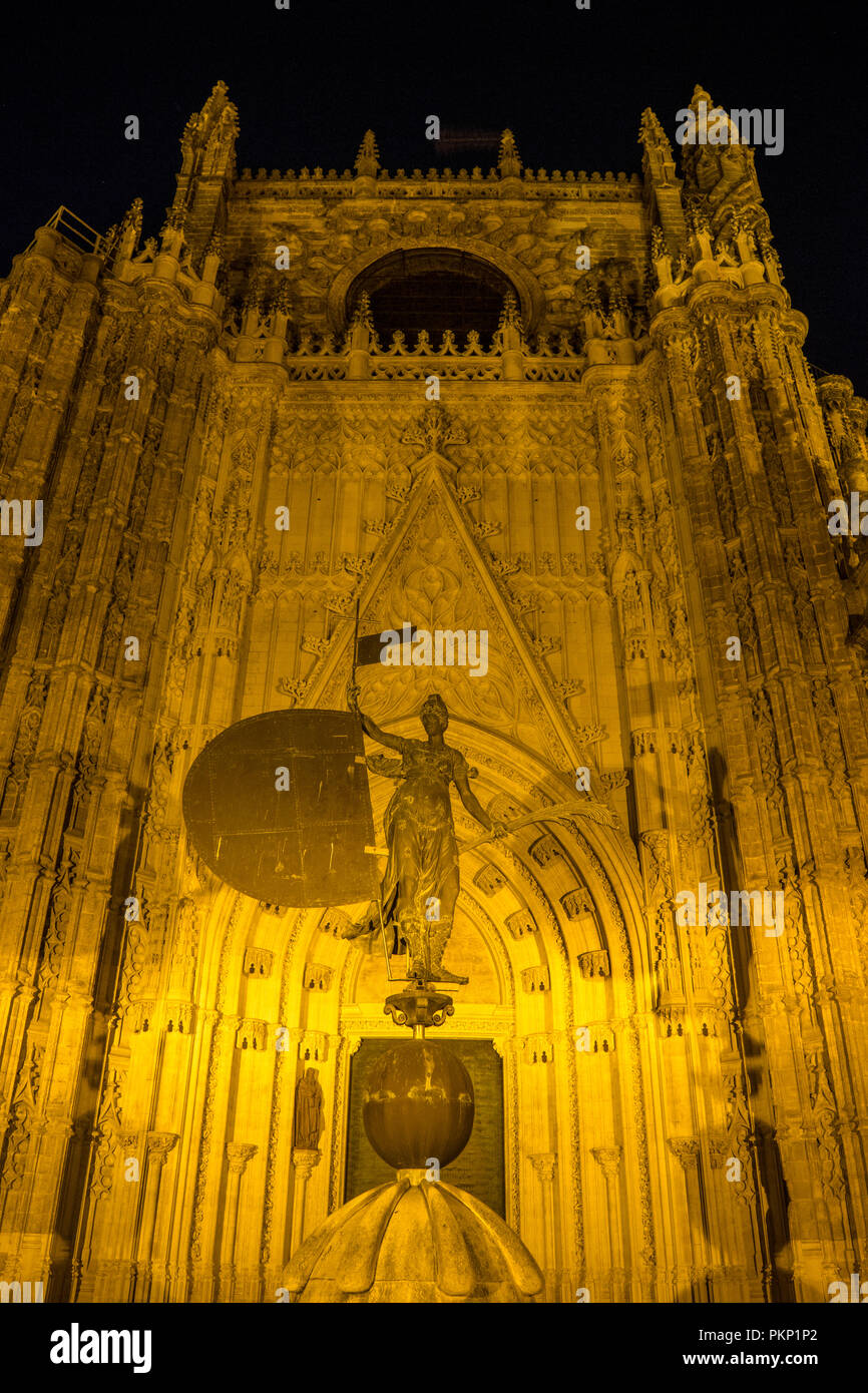 Seville, Spain- June 18, 2017:The entrance of the gothic cathedral is illuminated at night in Seville, Spain June 2017 Stock Photo