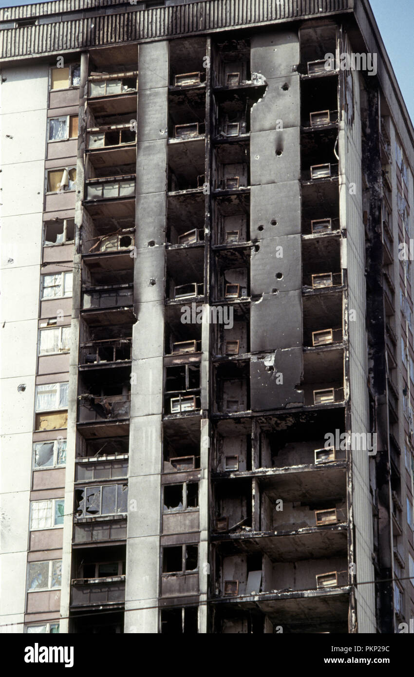 15th March 1993 During the Siege of Sarajevo: detail of damage from artillery and sniper-fire on a high-rise apartment block. Stock Photo