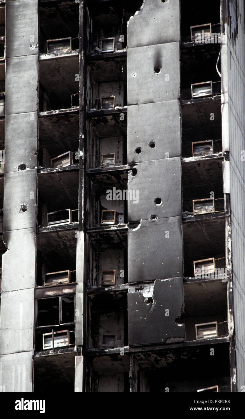 15th March 1993 During the Siege of Sarajevo: detail of damage from artillery and sniper-fire on a high-rise apartment block. Stock Photo
