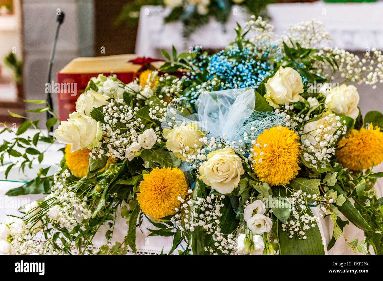flowers on altar in Catholic church in Italy Stock Photo - Alamy