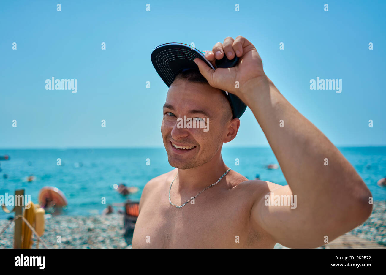 man in the cap on the beach Stock Photo Alamy