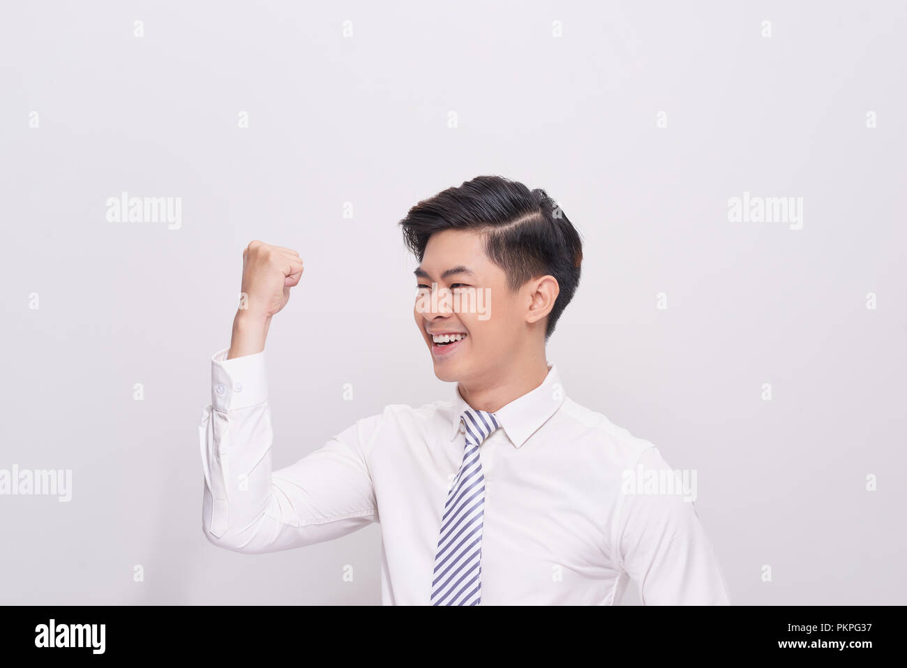 Portrait of happy excited young asian businessman Stock Photo - Alamy