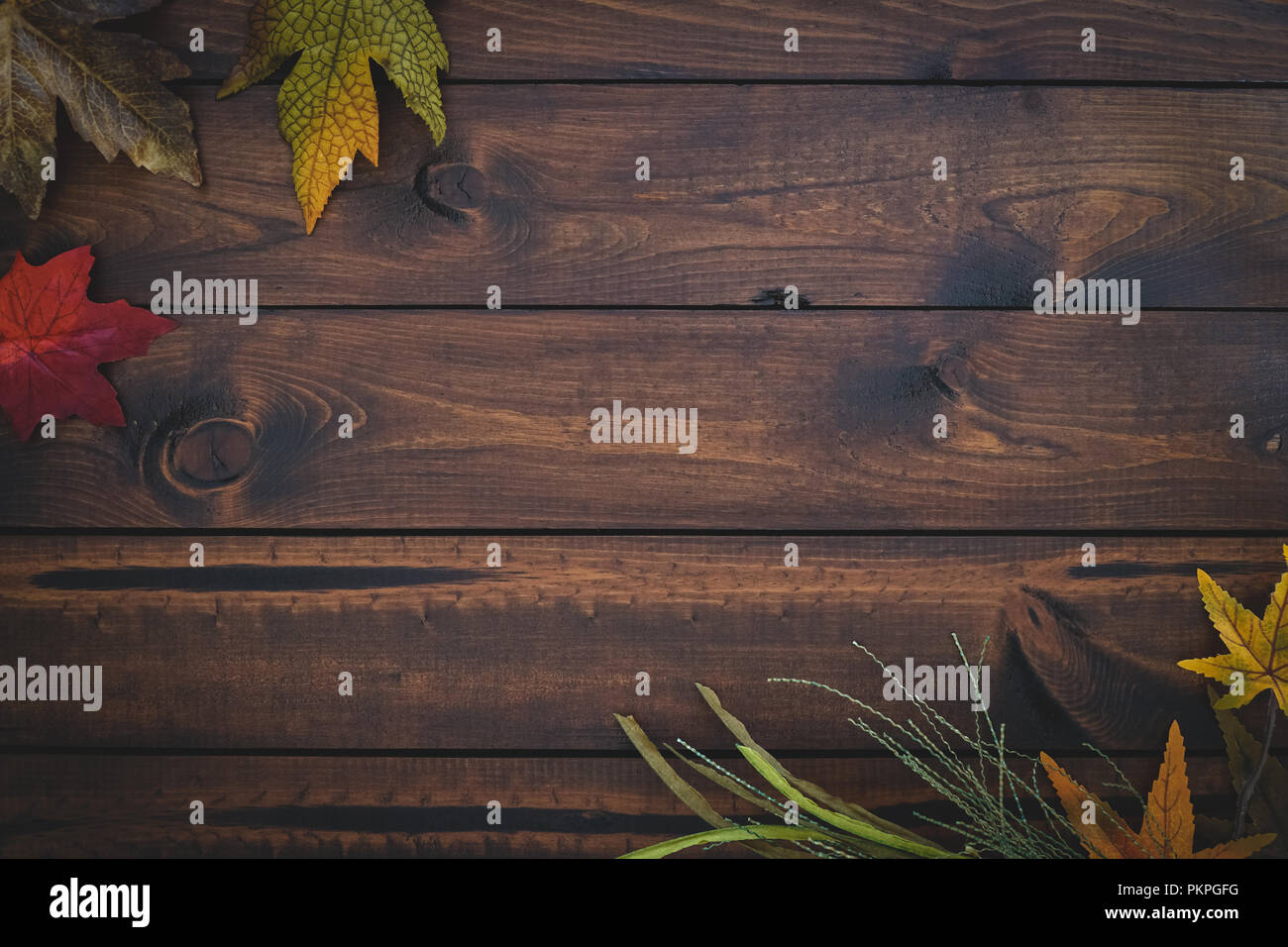 Autumn leaves over wooden background with copy space Stock Photo - Alamy