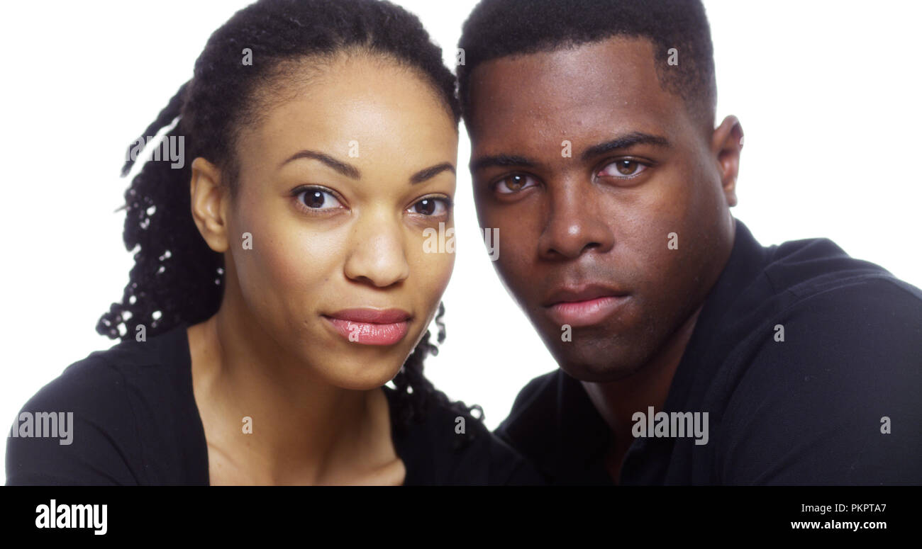 Portrait of serious young black couple looking at camera Stock Photo ...