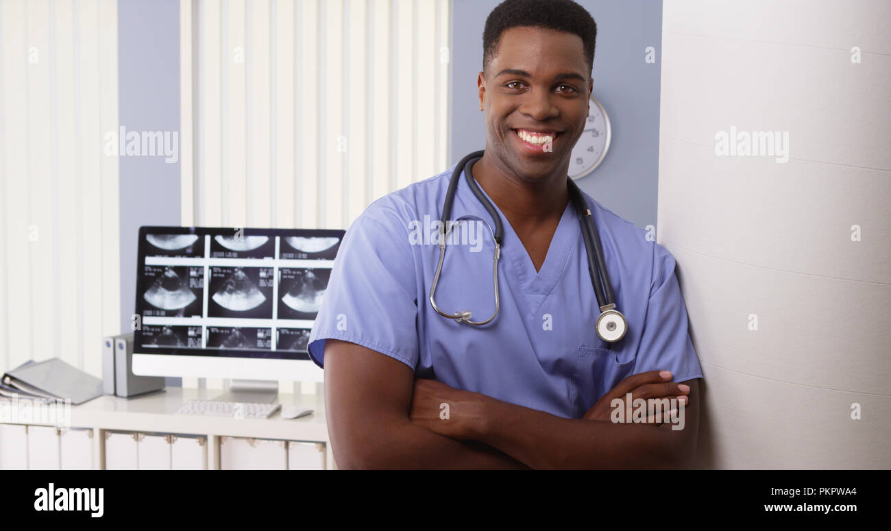 Standing black doctor crossing hi-res stock photography and images - Alamy