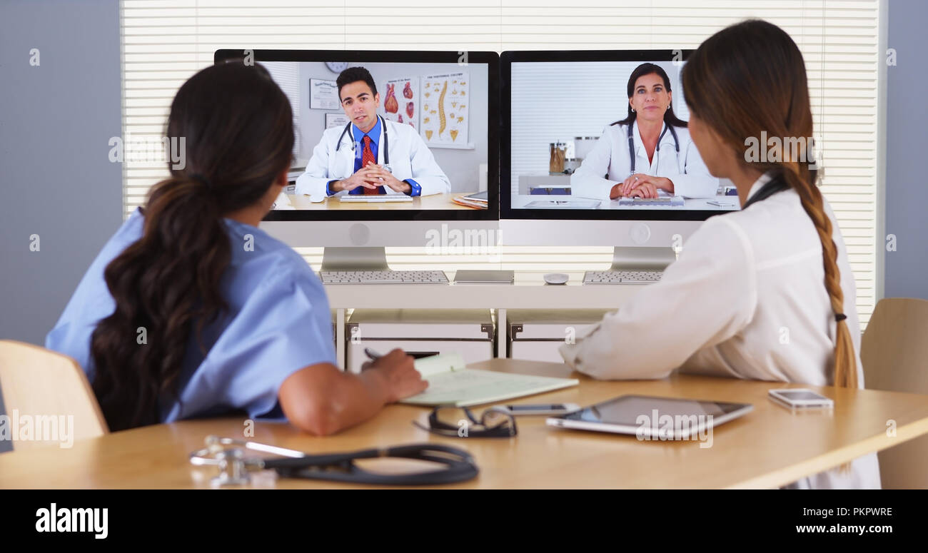 Team of diverse medical doctors having a video conference Stock Photo