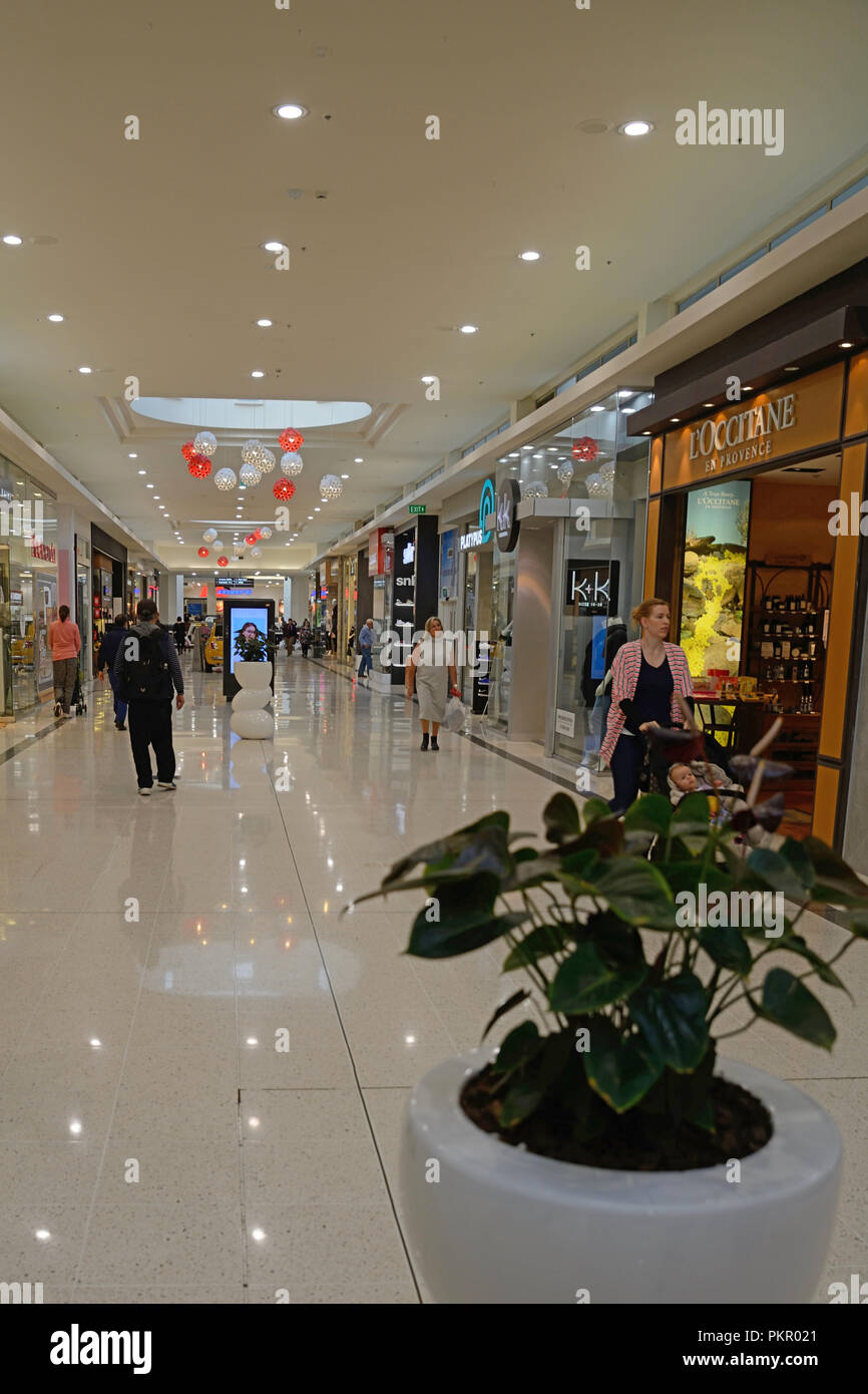 Shop displays beckon to customers at a Christchurch Shopping mall Stock ...