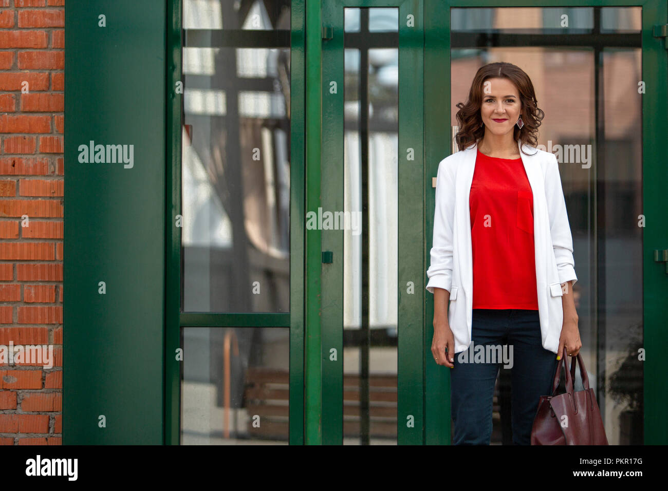 Portrait of a beautiful stylish business woman outdoors Stock Photo