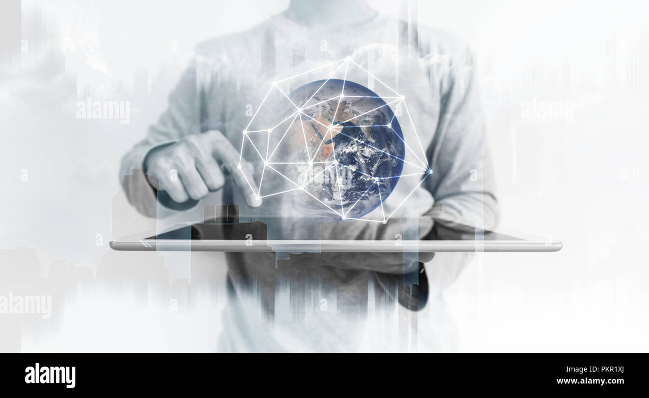 a man using digital tablet with global network connection technology hologram. Element of this image are furnished by NASA Stock Photo